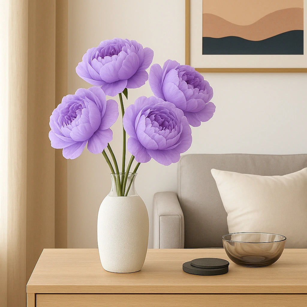 Purple flowers in a white vase on a wooden side table with a neutral-colored wall and framed artwork in the background.