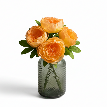 Bouquet of orange roses in a green vase on a white background