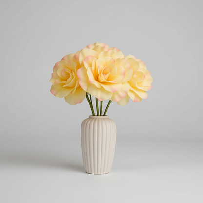 Yellow flowers in a beige vase on a light gray background