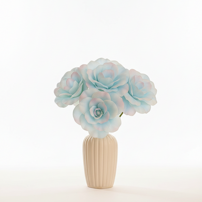 Decorative flower arrangement in a beige vase on a white background